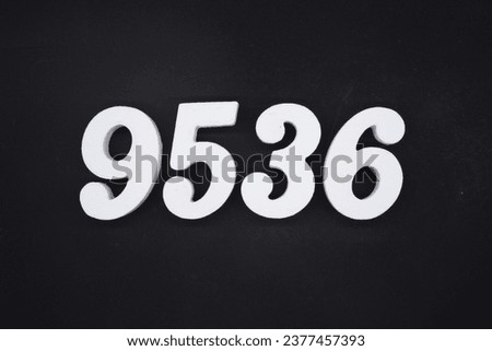 Black for the background. The number 9536 is made of white painted wood.