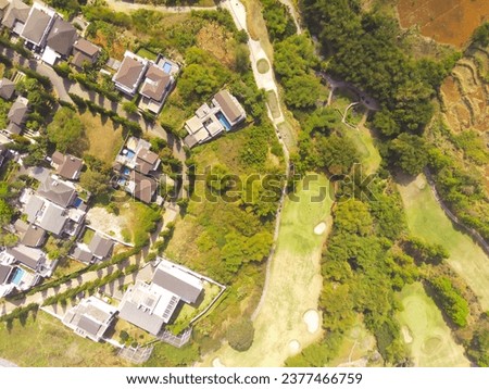 Golf Courses and elite housing. Drone Photography of a very wide golf course landscape surrounding the elite housing complex, Bojong Koneng - Bandung, Indonesia. Aerial Drone Photography
