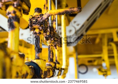 Close-up of corroded steel pipe, corrosion and valve of steel, general corrosion, offshore petroleum pipelines. Royalty-Free Stock Photo #2377469581