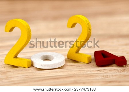 Happy New Year 2024 with colorful wooden numbers close-up