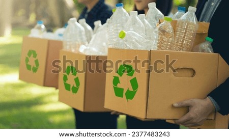 CSR  corporate social responsibility. Business people holding box garbage for recycling. Earth Day, Business teamwork to recycle for environmental sustainability. volunteer, Unity. team business. Royalty-Free Stock Photo #2377483243