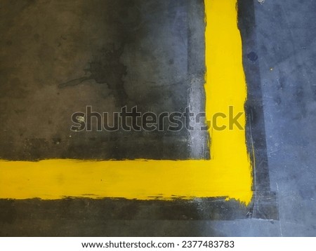 make a yellow line using paint and duct tape on the factory floor