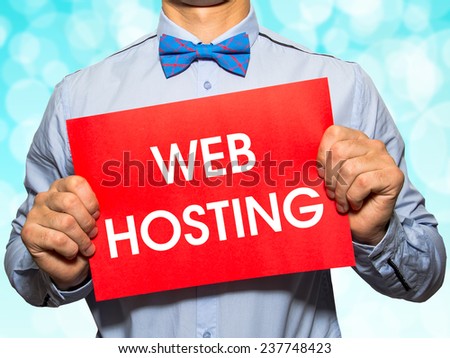 Man holding a card with the text Web hosting on white background