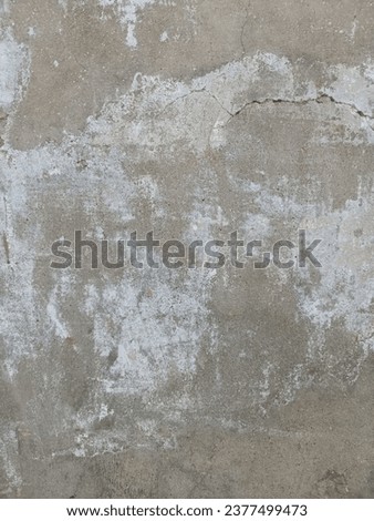 Wall texture with scratches and cracks.Grunge Background Texture Dirty Splash Painted Wall.Texture of old concrete wall.Concrete wall of light grey color.old grunge textures with scratches and cracks.