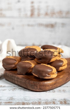 Chocolate cookie. Chocolate chip cookies baked with almond flour on a wooden background. patisserie products
