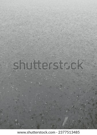 Picture of rain falling on the river