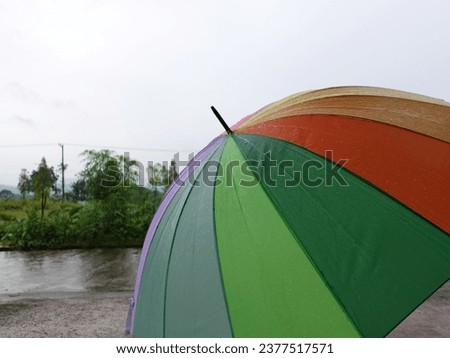a beautiful rainbow colored umbrella