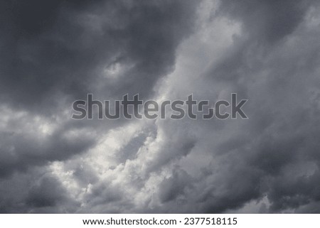 Blue sky with dark clouds Royalty-Free Stock Photo #2377518115