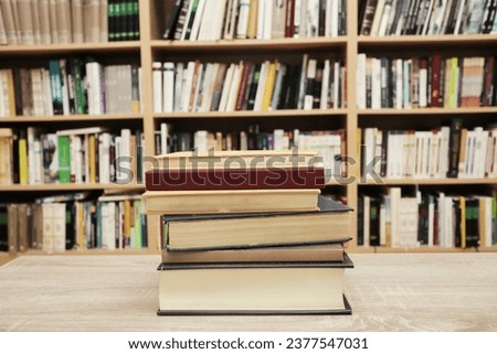 stack of books on the library table