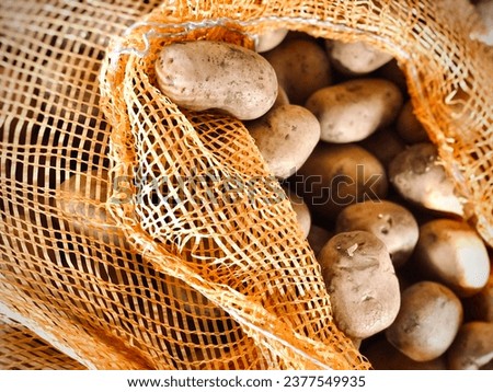 A picture of a collection of potatoes in sacks at a traditional market