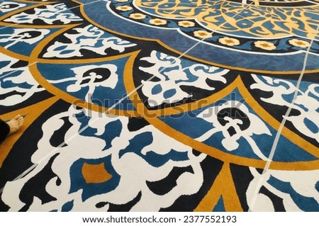 The luxurious carpet pattern in the Syekh Zayed Solo mosque displays elegant nuances. Royalty-Free Stock Photo #2377552193