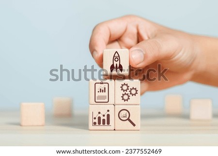 Wooden block showing business concept startup connection icon on modern virtual rocket, idea, growth, digital, technology, concept, unicorn, company, future, success, global Royalty-Free Stock Photo #2377552469