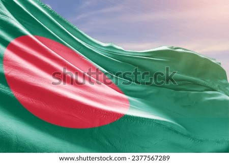 Bangladesh national flag waving in beautiful sky.