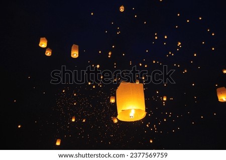 This is a photo of diwali celebration from the bank of Ganga river.Every year we all go there to light up the night sky with these flying lanterns also known as "fanush". Royalty-Free Stock Photo #2377569759
