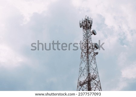 Mobile phone signal tower with sky in the background