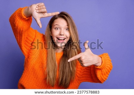 Portrait of lovely cheerful person arms fingers demonstrate cadre symbol isolated on purple color background