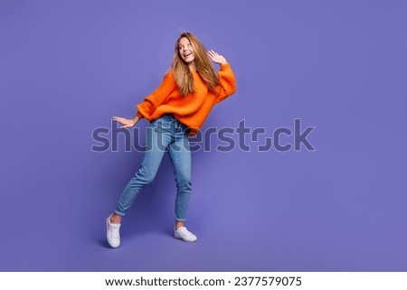 Full length photo of charming teen girl dance having fun hip hop moves discotheque thanksgiving holiday isolated on violet color background