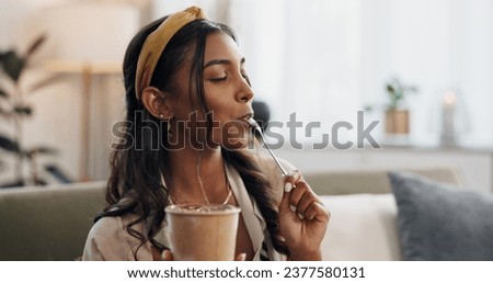 Woman, eating ice cream and sofa in house, thinking or idea for dessert, sweets or relax in living room. Girl, gelato or frozen yogurt for snack, lounge couch and home with memory, choice or decision Royalty-Free Stock Photo #2377580131