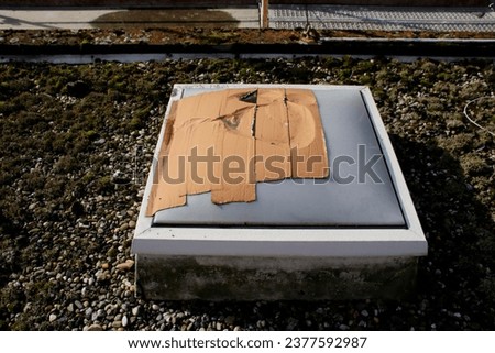 The skylight of a hall was damaged during work and was masked off Royalty-Free Stock Photo #2377592987