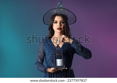 Young witch with lantern on dark color background
