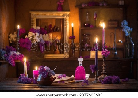magic potion of lilac flowers in the witch's house Royalty-Free Stock Photo #2377605685