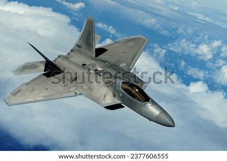 An F-22 Raptor from the Hawaii Air National Guard conducts training over the Pacific near the Hawaiian island of Oahu Royalty-Free Stock Photo #2377606555