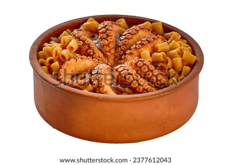 Whole octopus cooked with Greek macaroni and tomato, traditional Greek mud pot with sea food pasta, octopus with tomato and cut macaroni aerial view