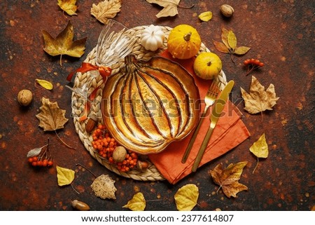 Beautiful table setting for Thanksgiving Day celebration on grunge brown background