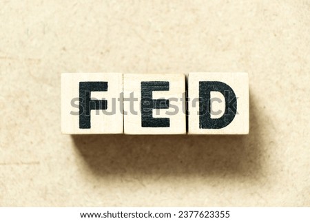 Alphabet letter block in word fed on wood background