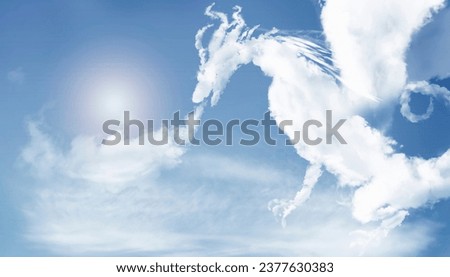 Dragon clouds shape. The symbol of 2024. Royalty-Free Stock Photo #2377630383