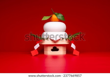 Kagamimochi" is an offering to the gods.
Kagamimochi" placed in the center of the red background.
Low pedestal. Ceramic rice cake. Royalty-Free Stock Photo #2377669857