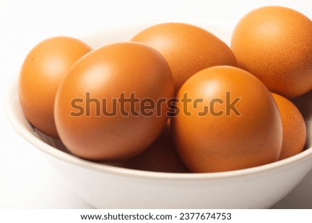 Photo of eggs in a bowl on a white background