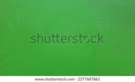 The background texture of the wall is green. Hue images. Greenscreen