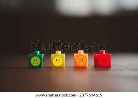 Image of emotions on Choosing a positive wooden blocks. Joy, calm, anger. Mental health and emotional state concept
