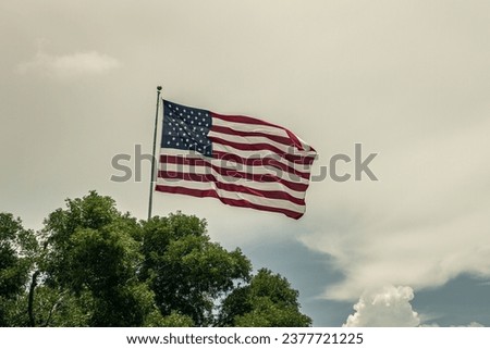 Big american flag waving in a wind, florida, miami, usa