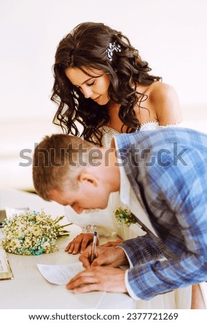 Groom write on registration of Marriage, man signing a marriage Contract