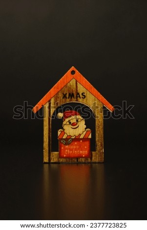 Christmas decoration, Santa Claus in a house on a dark background. Merry Christmas