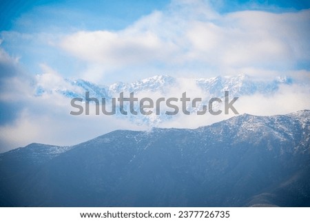 San Gabriel Foothills and Snow-Capped Mountain Peaks 