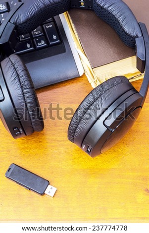 Headphones USB flash drive and computer keyboard