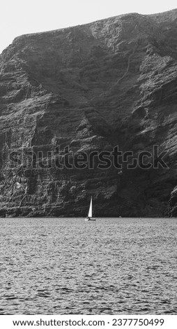 a sailboat navigating around Los Gigantes in Tenerife south, Canary Islands. I decided to edit this picture in black and white