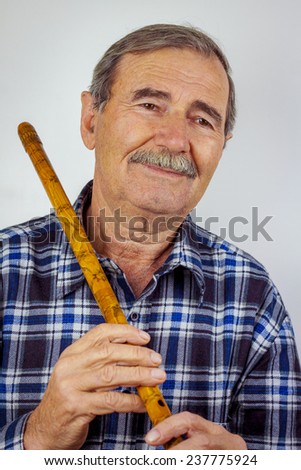 Man playing on pipe flute.Traditional folk instruments of Macedonia Europe