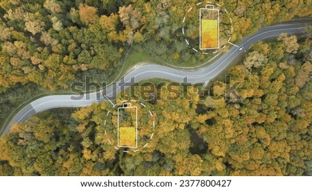 Electric cars driving with digital graphic of battery energy level in a forest during autumn season. Renewable energy futuristic concept