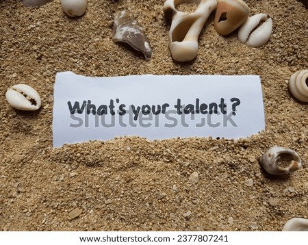 Whats your talent written on the beach sand background.