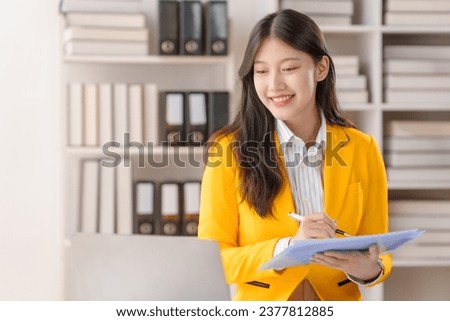 Female loan service providers asian people business professionals ensuring easy loan processes, working diligently, guiding clients through financial pathways, and mapping success. Royalty-Free Stock Photo #2377812885