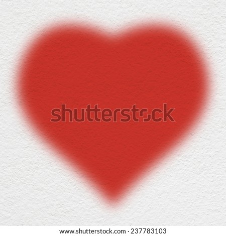 heart spray painting on  the white wall
