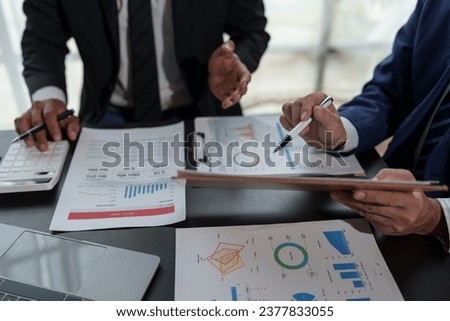 Asian business advisor meeting to analyze and discuss the situation on the financial report in the meeting room. brainstorming, discussing, and analyzing business strategy. Financial advisor concept