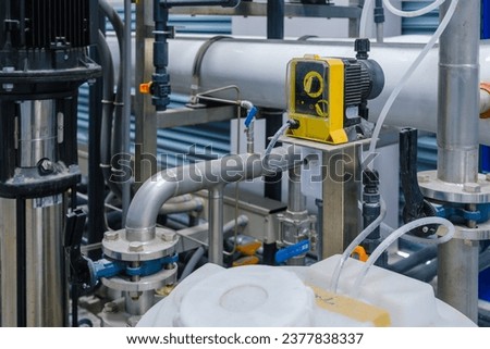 Chemical pump used in reverse osmosis system,water filtration plant. The feed pump chemical into the pipe water. Royalty-Free Stock Photo #2377838337