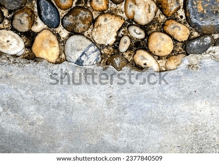 a wall of rocks in a garden.