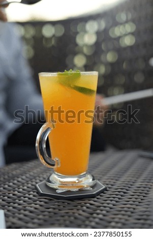 Cold drink with orange juice on the table