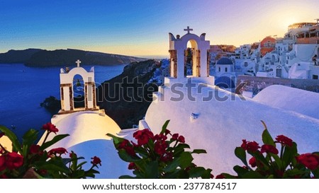 sunset by the ocean of Oia Santorini Greece, a traditional Greek village in Santorini with whitewashed churches and blue domes Royalty-Free Stock Photo #2377874517